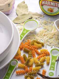 Vegan Pantry category picture with cooking ingredients, measuring spoons, and plates.