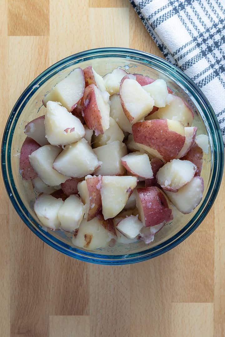Cooked and fluffed potatoes set aside for an easy vegan side dish or vegan BBQ dish