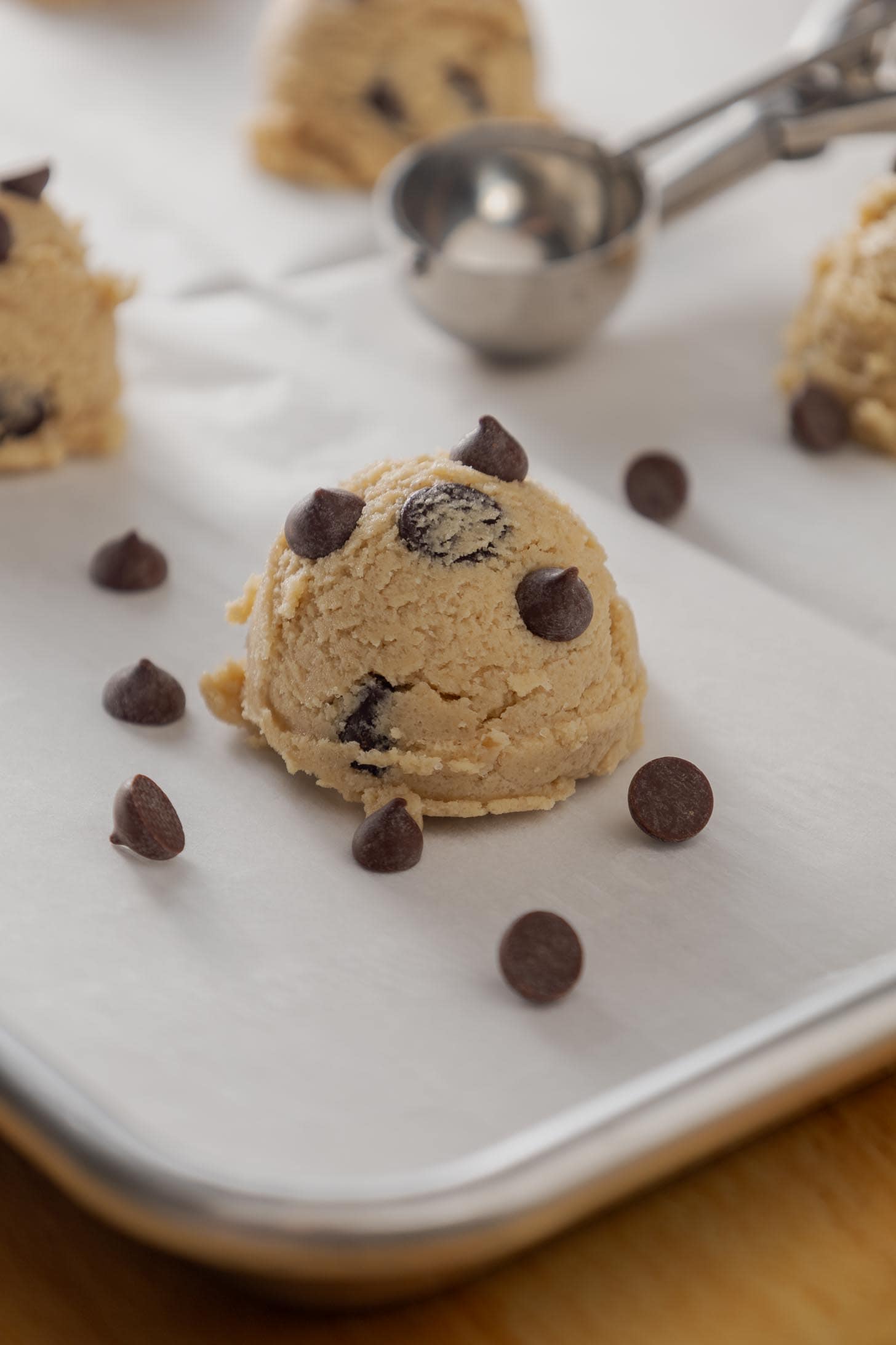 Scoops of dough for this vegan cookie recipe