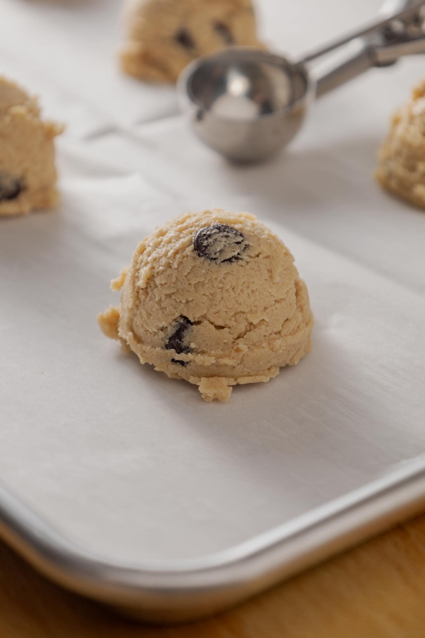 Scoops of dough for this vegan cookie recipe