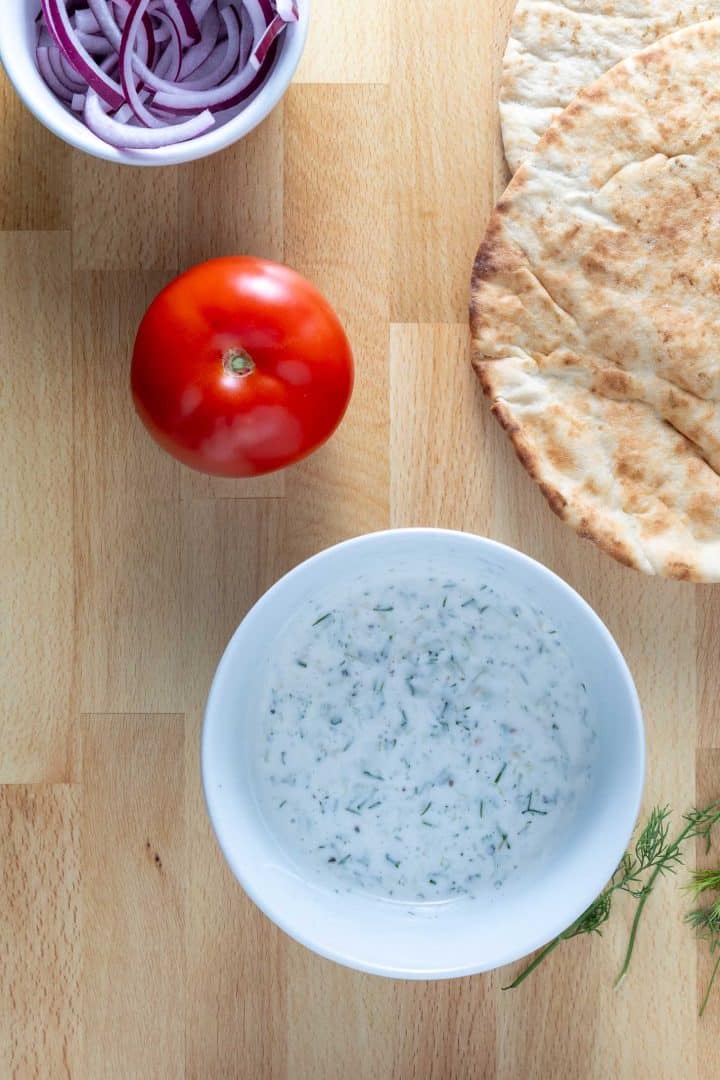 Fresh herby tzatziki made with plant based plain yoghurt