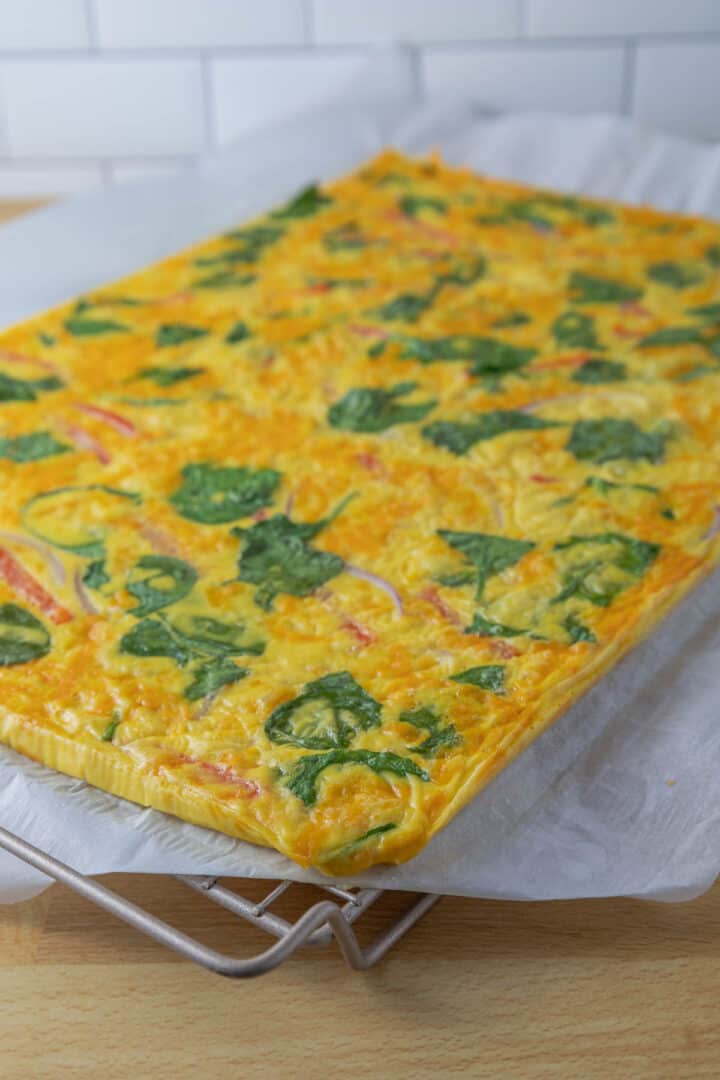 Cooked and cooled sheet pan egg squares can be sliced for sandwiches