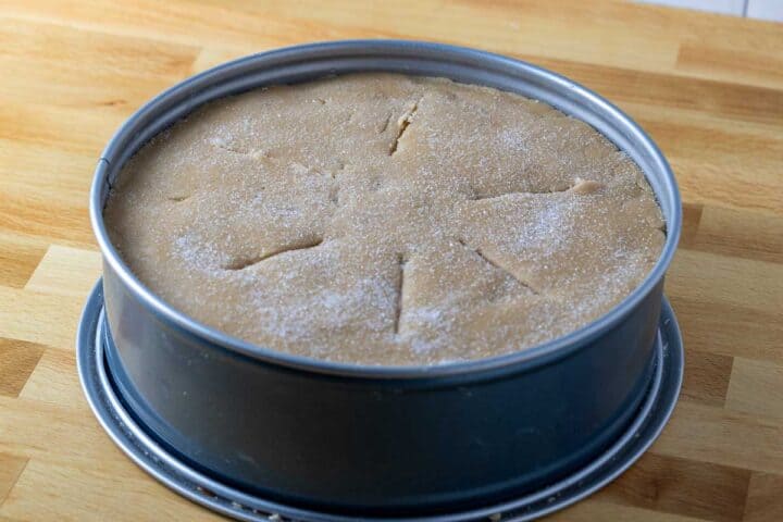 Apple pie topped with an easy circle of dough, scored for moisture to escape while baking