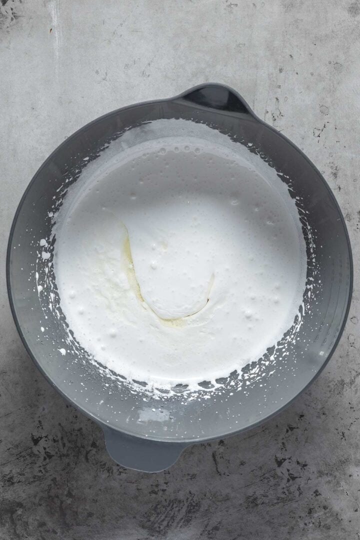 Adding the oil and the flavor extract to the wet ingredients. 