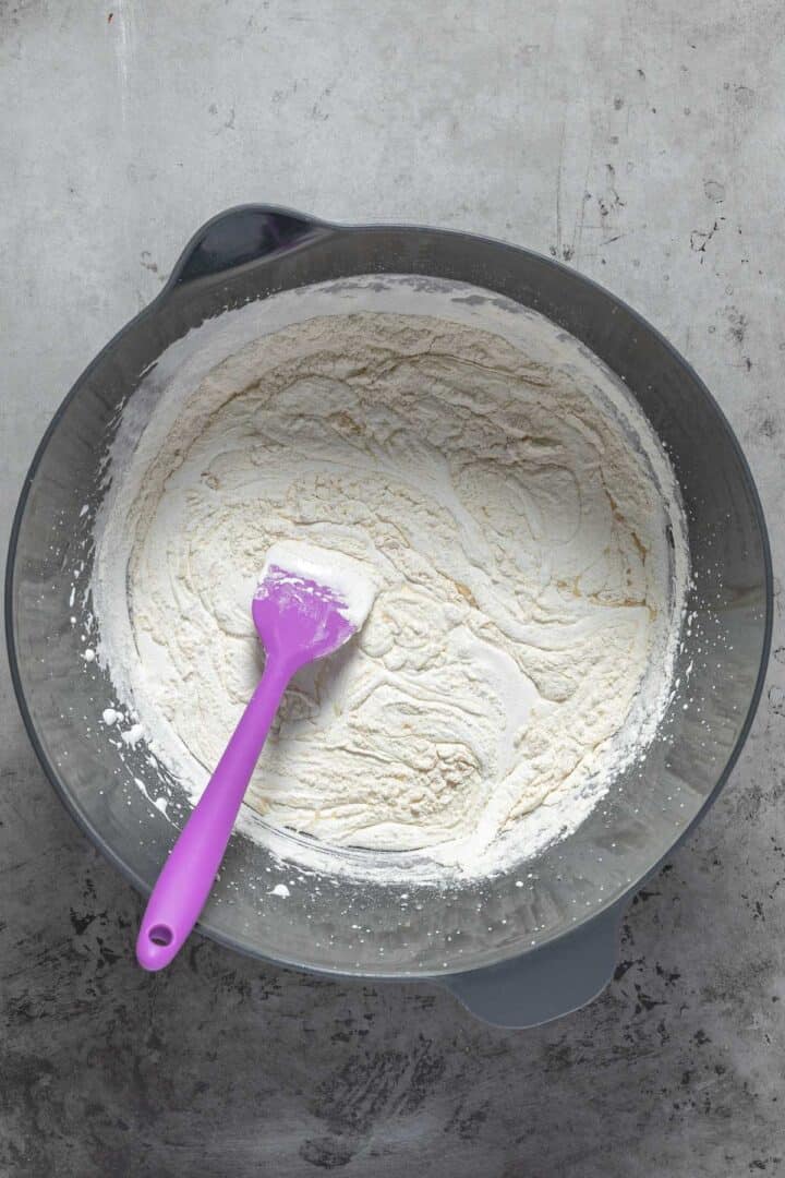 Folding in half of the dry ingredients for the biscotti recipe. 