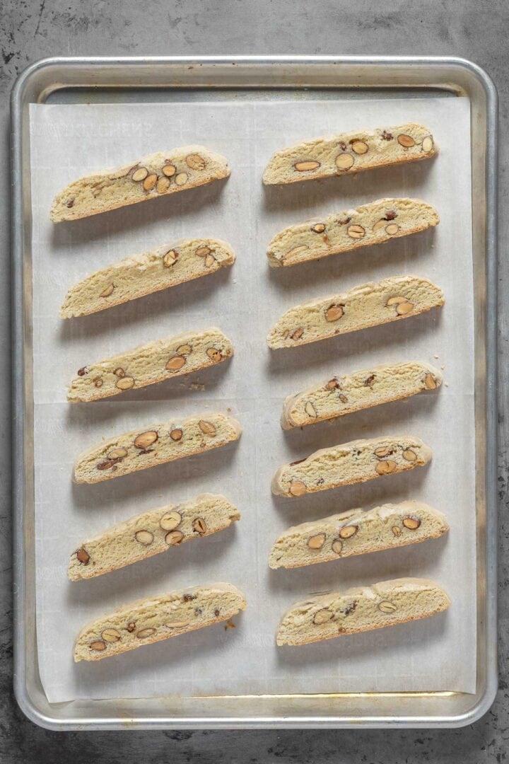 Arranged the sliced biscotti back onto the parchment lined baking sheet to cook a bit more. 