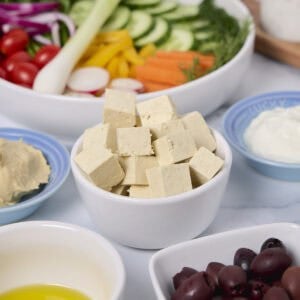 Feature image for this post about making your own easy tofu feta brined with vegan lactic acid
