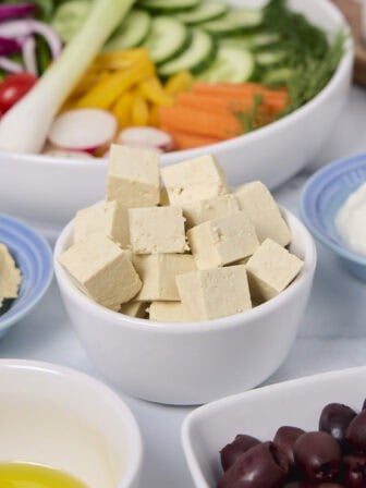 Feature image for this post about making your own easy tofu feta brined with vegan lactic acid